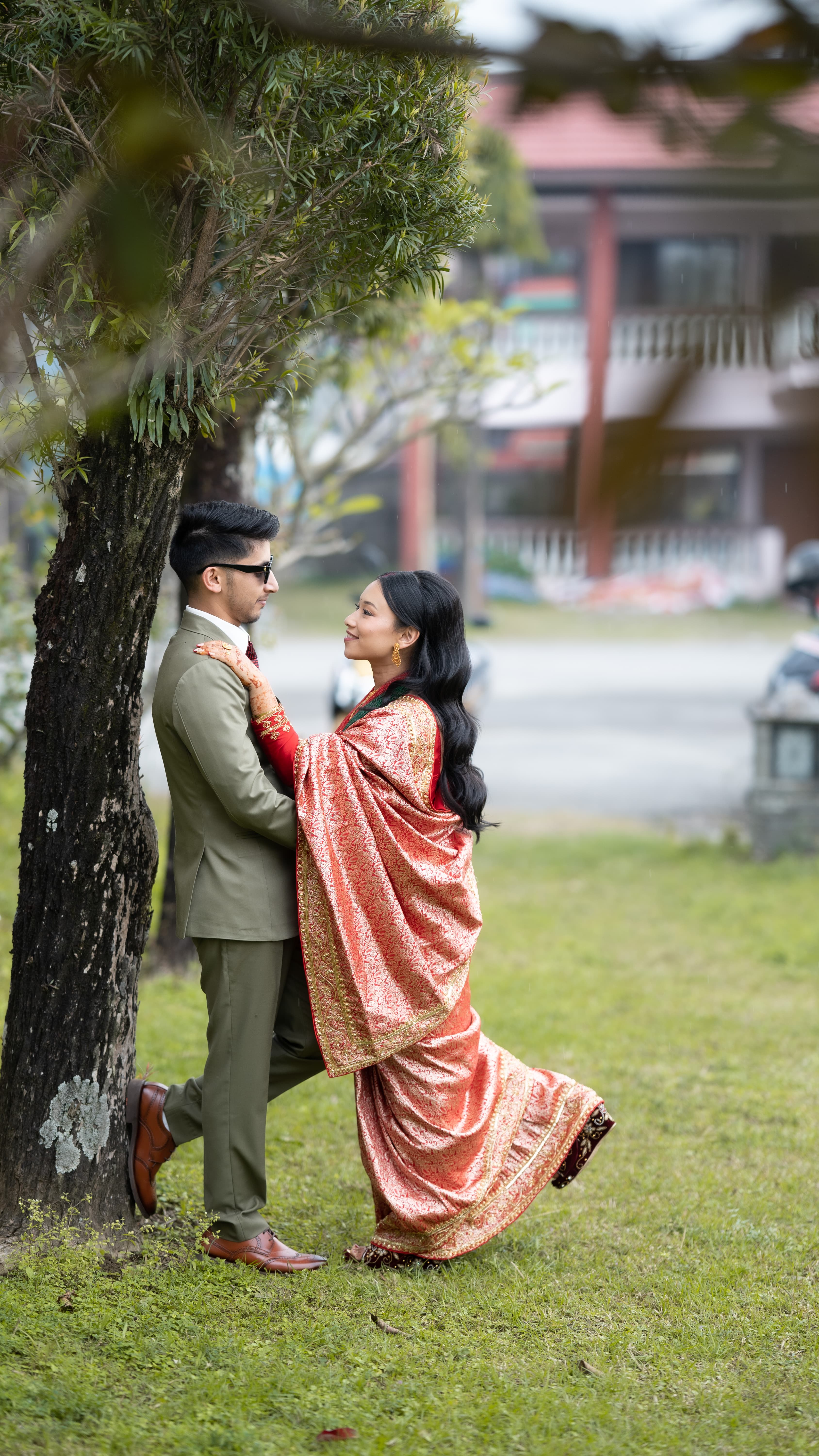 Pre-wedding couple portrait under a tree in Pokhara